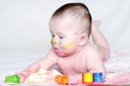 Portrait of baby with multi-colored paints