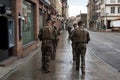 Portrait on back view of french soldier patrolling in the street