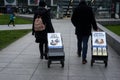 Portrait on back view of Jehovah witnesses standing in the street