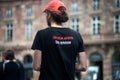 Portrait on back view of man wearing a teeshirt with text in french : liberation animale stop specisme, in english : animal libera