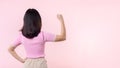 Portrait back of woman proud and confident showing strong muscle strength arms flexed posing, feels about her success achievement