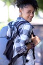 Portrait, backpack and happy student at park, university or outdoor campus in summer. Face, bag and smile of woman at