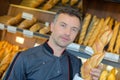 Portrait baker holding baguette Royalty Free Stock Photo