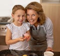 Portrait, baking and girl with grandmother in kitchen of home for growth, learning or child development. Family, smile