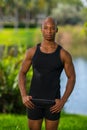 Portrait of a bald fitness model posing in a tank top t-shirt Royalty Free Stock Photo