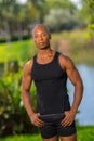 Portrait of a bald fitness model posing in a tank top Royalty Free Stock Photo