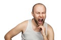 Portrait a bald guy in a white t-shirt sits on a chair and thinks about problems with money, loneliness, payments, work and