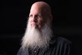 Portrait Of Bald Man With Gray Beard Thinking Outdoors At Night Royalty Free Stock Photo