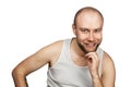 Portrait bald man laughing mockingly at something or someone on an isolated white background Royalty Free Stock Photo