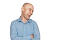 Portrait bald man laughing mockingly at something or someone on an isolated white background