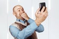 Portrait Bald man talking on the phone and selfie Royalty Free Stock Photo