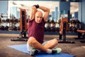 A portrait of senior man doing stretching after training in the gym. People, healthcare and lifestyle concept Royalty Free Stock Photo