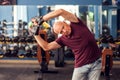 A portrait of senior man doing workout before training in the gym. People, healthcare and lifestyle concept Royalty Free Stock Photo