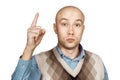 Portrait Bald serious man points and threatens with forefinger on an isolated white background Royalty Free Stock Photo