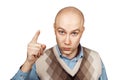 Portrait Bald serious man points and threatens with forefinger on an isolated white background Royalty Free Stock Photo