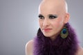 Portrait of bald woman in purple boa Royalty Free Stock Photo