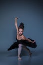 Portrait of the ballerina in ballet tatu on blue Royalty Free Stock Photo