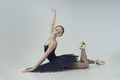 portrait of a ballerina in a black tutu lying on the floor leaning on her hands Royalty Free Stock Photo