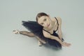 portrait of a ballerina in a black tutu lying on the floor leaning on her hands top view Royalty Free Stock Photo