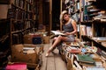 Portrait of ballerina girl in vintage book store wearing casual clothes Royalty Free Stock Photo