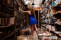 Portrait of ballerina girl in vintage book store wearing casual clothes Royalty Free Stock Photo