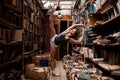 Portrait of ballerina girl in vintage book store wearing casual clothes Royalty Free Stock Photo