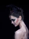 Portrait of the ballerina in the role of a black swan on black background Royalty Free Stock Photo