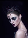 Portrait of the ballerina in the role of a black swan on black background Royalty Free Stock Photo