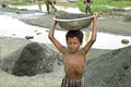 Portrait of Bangladeshi boy working in gravel pit Royalty Free Stock Photo