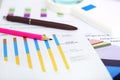 Portrait of bar graph, pen, pencil and magnifying glass Royalty Free Stock Photo