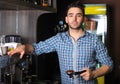 Portrait of a barista making a cup of coffee Royalty Free Stock Photo