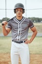 Portrait of baseball player looking focused with paint on his face. Serious and fit, active athlete wearing a helmet Royalty Free Stock Photo