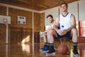 Portrait of basketball players sitting on bench