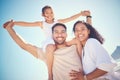 Portrait, beach and happy family smile, piggyback and bond outdoor against blue sky background. Travel, face and girl Royalty Free Stock Photo