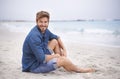 Portrait, beach and man with a smile, travel and summer holiday with weekend break and water. Waves, face and person Royalty Free Stock Photo