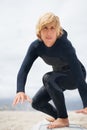 Portrait, beach and a man surfing instructor on sand, teaching balance, skill or technique. Fitness, summer and a young