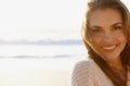 Portrait, beach and woman with vacation, smile and getaway trip with water and weekend break. Face, person and girl with Royalty Free Stock Photo
