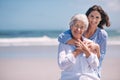 Portrait, beach and young woman with her senior mother embrace and smile together outdoors on mockup. Family, happy and