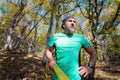 Portrait of a bearded athletic man engaged in slack next to a stretched sling for balance in the autumn forest. athlete Royalty Free Stock Photo