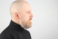 Portrait of a bearded and bald man in profile Royalty Free Stock Photo