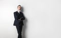 Portrait of bearded confident gentleman wearing trendy suit standing over empty white background. Copy Paste text space.