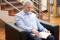 Portrait of bearded elderly man reading book Royalty Free Stock Photo