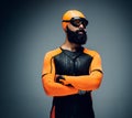 Male in scuba diving mask and orange neopren diving suit. Royalty Free Stock Photo