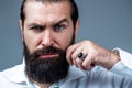 Portrait of bearded male in white shirt. Close up of handsome beard hipster elegant male. Bearded man close up. Beard is