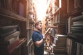 Portrait of a bearded man reading a book in an old public library Royalty Free Stock Photo