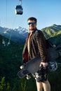 Skater traveling in the mountains on his longboard