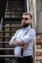 Portrait of bearded man with tattooes on his arms Royalty Free Stock Photo