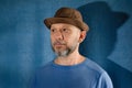 Portrait of a bearded middle-aged man wearing a hat