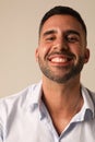 Portrait of bearded optimistic young man on white background. Vertical mock-up.