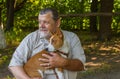 Portrait of a bearded senior man with his basenji dog Royalty Free Stock Photo